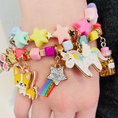 This star stretch bead charm bracelet is naturally the star of her charm bracelet stack! Add charms between the beads of this bracelet and customize her collection! features & materials Base Metal Acrylic 6" length WARNING: Choking Hazard - Small parts. Not for children under 3 years. Bracelet only, charms sold separately Charm Bracelet Stack, Decoupage Tins, Ruffles Potato Chips, Tiny Bottles, Kid Design, Custom Charm Bracelet, Honey Love, Bottle Charms, Kawaii Jewelry