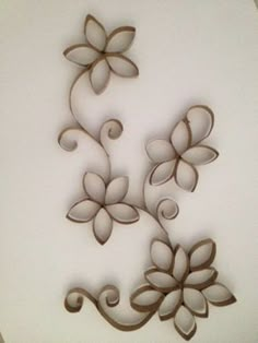 decorative metal wall art with flowers and swirls