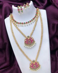 This traditional gold plated Indian wedding jewelry combo features a long-short necklace, complete with American diamond, cz diamond crystals, as well as ruby emerald and white cz stones. Perfect for a special occasion, make a statement with this beautiful gold plated ad haram necklace. South Indian Wedding Jewelry, Jewelry Combo, Indian Wedding Jewelry Sets, Necklace Combo, American Diamond Necklaces, Oxidized Necklace, Wedding Jewelry Set, Bangle Ring, Ruby Emerald