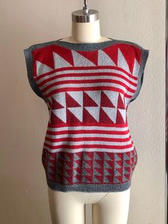 Rad 80s geometric sweater shirt/vest, maroon and gray colors. No tags but fits like a women's size small/medium. Shown here on a size 4 mannequin. Use measurements below for reference. A small discoloration spot (unnoticeable) shown in last photo. Measurements laying flat: 18.5 inches pit y 20.5 inches collar to hem Thanks for looking :) Fall Jacquard Knit Sleeveless Sweater Vest, Fitted Sweater Vest For Winter Layering, Fall Cotton Stretch Sweater Vest, Winter Jacquard Knit Sleeveless Sweater Vest, Winter Jacquard Knit Sleeveless Vest, Sleeveless Jacquard Knit Sweater Vest For Winter, Fitted Knit Sweater Vest For Winter, Jacquard Knit Sweater Vest For Fall, Fall Jacquard Knit Sweater Vest