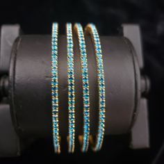 "* Handcrafted Gold Plated 4 Bangle Set. Sold as a set. * Bangles with high quality blue stones. * High Quality 22K Gold Plated. Bangles Sizes : 2.4 ( 2.20\" diameter of the inner circle) ; 2.6 ( 2.40\" diameter of the inner circle); 2.8 (2.50\" diameter of the inner circle) The gorgeous gold-plated bangles set best exemplifies the careful craftsmanship done on it -- specially picked for you by Nemali Jewelry. It has a special tone of elegance attached to it. The intricate handmade design of the Blue Hand-set Bracelet As A Gift, Blue Bangle Bracelet For Wedding, Blue Hand Set Bangle For Wedding, Blue Bangle Bracelets For Wedding, Blue Hand-set Bangle For Wedding, Adjustable Blue Stackable Bangle, Blue Festive Bracelet Jewelry, Festive Blue Bracelet Jewelry, Festive Blue Round Bangle