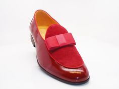 Style: 525-210SP-Red Exquisite combination of Patent Leather & Suede accent this slip-on Dress Loafer from Carrucci, featuring Grosgrain Bow and Piping, and a clean welt! Formal Slip-on Loafers With Red Sole, Red Slip-on Loafers With Plain Toe, Formal Slip-ons With Red Sole, Red Formal Dress Shoes For Spring, Red Spring Formal Dress Shoes, Classic Red Loafers For Semi-formal Occasions, Red Leather Dress Shoes For Spring, Fitted Red Leather Shoes For Office, Spring Red Leather Dress Shoes