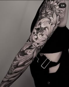 a woman's arm with flowers on it