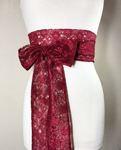 "Burgundy Lace Sash Wine Lace Sash Extra Long Wedding Dress Sash Maroon Lace Sash Bridal Belt Long Length Lace Wrap Belt Satin Swank This Satin Swank® extra long sash in burgundy floral lace brings a beautiful, yet simple romantic finishing touch to your wedding or bridesmaid dress, or adds a hint of nostalgic charm to an everyday dress or top. At 120 inches in length, this sash will wrap around most waist sizes two times with a generous length remaining to tie in a bow or a simple knot with lon Pink Bridal Belt With Sashes For Party, Elegant Fitted Pink Sashes, Wedding Sash With Tie Back, Fitted Lace Bridal Belt For Ceremony, Fitted Bridesmaid Sash, Fitted Bridal Belt With Sashes For Party, Lace Bridal Belt With Sashes For Wedding, Fitted Sashes Bridal Belt For Party, Elegant Lace Bridal Belt For Party