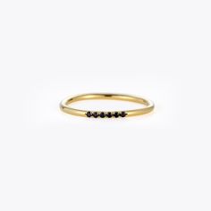 1.5 mm stack stimulated black stones band ring. Made in 18K Gold vermeil and set with 6 black stimulated diamonds. Material : 925 Sterling Silver - Zircon Finish : 18k Gold Width : 1.5mm Black Stone Ring, Dainty Band, Black Stones, Pave Band, Tiny Earrings, Eternity Band Ring, Pave Ring, Black Diamonds, Keep Jewelry