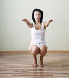 a woman sitting on the floor with her arms outstretched