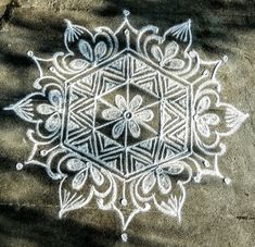 an intricate design is shown on the ground