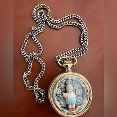 New Handcrafted Gold Tone Pocket Watch Pendant Necklace On Silver Tone Chain. Features Charming Little Boy Holding Rabbit Accented By Pearls And Lace. New, Excellent Condition. Vintage Stainless Steel Chain Necklace, Vintage Silver Stainless Steel Necklaces, Vintage Silver Stainless Steel Necklace, Vintage Silver Stainless Steel Pocket Watch, Vintage Silver Pocket Watch With Chain, Vintage Silver Stainless Steel Watches, Vintage Metal Pocket Watch As Gift, Handmade Vintage Pocket Watch As Gift, Vintage Handmade Pocket Watch As Gift