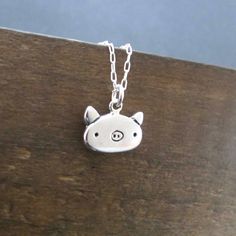 "This cute little pig necklace is made from sterling silver and measures about 1/2 of an inch tall and wide. Shipped as the charm only or on your choice of silver-plated or sterling silver cable chain in either 16\", 18\", or 20\". Please use the drop down menu for your options. To see the matching earrings go here: https://www.etsy.com/listing/551264706/pig-earrings-sterling-silver-pig?ga_search_query=pigs&ref=shop_items_search_8 To see all my little charms go here: https://www.etsy.com/sho Cute Sterling Silver Pendant Charm Necklaces, Cute Sterling Silver Pendant Charm Necklace, Cute Silver Sterling Silver Charm Necklaces, Cute Nickel-free Sterling Silver Necklaces, Cute Hypoallergenic Sterling Silver Necklaces, Cute Hypoallergenic Sterling Silver Necklace, Adjustable Delicate Sterling Silver Charm Necklace, Cute Sterling Silver Charms Jewelry, Ugly Rat