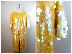 "Here's an absolutely breathtaking vintage piece fully embellished with iridescent paillette sequins. It's in excellent condition! There are a total of 18 buttons so it could also be worn as a dress. Measurements are taken with all closures intact. Bust - 40\" Waist - 40\" Hips - 40\" Top to Bottom - 39\" Tag Size - Medium All of my items come from a smoke-free and pet-free home. If you have any questions, please don't hesitate to ask!" Long Cardigan Sweater, Blue Green Gold, Duster Jacket, Sequin Sweater, Cardigan Sweater Dress, Black Sequin Dress, Vintage Beaded Dress, Long Sweaters Cardigan, Button Down Dress