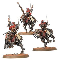 three painted warhammers with spears and swords on their backs, standing in front of each other