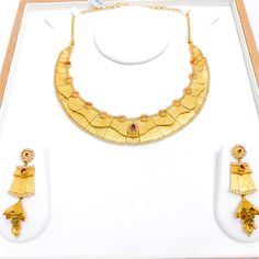 PRODUCT DETAILS Gold Purity(karat): 22k Item Weight(grams): 82.5 Item Finish: Antique Finish Stone: Kundan Set Length: 17" Adjustable Links: 1.5" Links Lock Style: Hook Lock Matching Earrings: Included Earring Length: 2.5" Earring Post: Screw Back Yellow 22k Gold Hallmarked Jewelry, Yellow Gold Round Kundan Necklace In Temple Style, Yellow Gold Round Kundan Necklace Temple Jewelry, Yellow Gold Round Kundan Temple Necklace, 22k Gold Temple Jewelry In Yellow, 22k Gold Yellow Temple Jewelry, Yellow 22k Gold Temple Jewelry, Ceremonial Gold Kundan Necklace Hand Set, Heavy Yellow Gold Temple Necklace As Gift