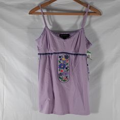 Nwt Inc International Concepts Purple With Embroidered Flowers Hanging From Bustling Sz M And L. Adjustable Shoulder Straps. Approximate Measurements: Sizes. M L Pit - Pit Across. 16" 17" Pit - Hem. 17.5" 18" Waist Across. 18" 20" Ab - 43. Ab - 44 Casual Embroidered Tank Top For Summer, Summer Embroidered Cotton Tank Top, Summer Cotton Embroidered Tank Top, Embroidered Fitted Tank Top For Spring, Fitted Embroidered Tank Top For Spring, Cotton Camisole With Floral Embroidery, Cotton Floral Embroidered Camisole, Floral Embroidery Cotton Camisole, Embroidered Sleeveless Fitted Top