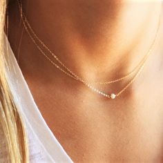 This Ultra Dainty Layered Necklace set of two necklaces is wonderful for everyday wear and for special occasions. A perfect way to wear layers with a minimal look and a touch of sparkle. •Two separate chains to wear together or alone •Top Layer - simple delicate chain •Bottom Layer - tiny freshwater pearl wrapped by hand 100% 14kt Gold-Filled or sterling silver Model is wearing 16-17" in Photos Everyday Layered Pearl Chain Necklace, Dainty Jewelry With Pearl Chain For Layering, Dainty Jewelry For Layering With Pearl Chain, Dainty Layering Pearl Chain Necklaces, Dainty Layering Pearl Chain Necklace, Dainty Layering Necklaces With Pearl Chain, Minimalist Double Strand Clavicle Chain Layered Necklace, Minimalist Layered Everyday Jewelry, Minimalist Everyday Layered Necklaces