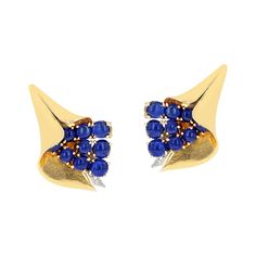 A pair of Mauboussin Sapphire Cabochon Earrings by Trabert & Hoeffer in the Reflection Collection by MAUBOUSSIN. There are 9 sapphire cabochons on each earring with Diamonds. The earrings are made in 18 Karat Yellow Gold. Designed and executed for Harriet P. Kennedy. Matching Brooch available. Bracelet Tags, Sapphire And Diamond Earrings, Platinum Earrings, Round Sapphire, 18k Gold Earrings, Calla Lilies, White Gold Earrings, Emerald Earrings, Champagne Diamond