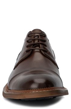 A classic cap toe brings a polished aesthetic to a contemporary derby made of supple leather. Lace-up closure Cushioned footbed Cap toe Leather upper and lining/rubber sole Imported Timeless Cap Toe Dress Shoes For Derby, Timeless Cap Toe Leather Shoes For Derby, Cap Toe Dress Shoes With Goodyear Welt For Derby, Brown Cap Toe Oxfords For Derby, Classic Derby With Rubber Heel Cap And Plain Toe, Classic Plain Toe Derby With Rubber Heel Cap, Brown Cap Toe Derby With Goodyear Welt, Brown Cap Toe Derby With Goodyear Welted, Brown Cap Toe Lace-up Shoes For Derby