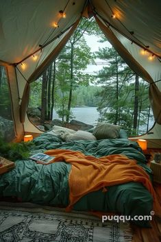 a tent with a bed and lights in it