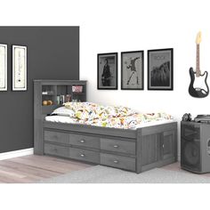 a bedroom with a bed, guitar and pictures on the wall