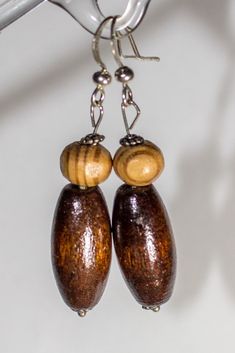 These are handmade natural earrings made of wood with metal ear-wires.                                          It is lightweight and comfortable antique style , modern earrings.                               Made of various natural wood and metal details, stone and crystals.                                                                    Hand crafted is an individual design that you will not find anywhere else. Artisan Brown Beaded Earrings For Pierced Ears, Brown Wooden Dangle Jewelry, Brown Wooden Drop Earrings, Brown Wood Drop Earrings, Bohemian Brown Wooden Earrings, Handmade Wooden Drop Earrings, Handmade Wood Drop Earrings, Bohemian Wooden Bead Earrings, Brown Wooden Earrings For Pierced Ears