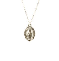 Virgin Mary medallion necklace, miraculous medal necklace, catholic, protection, a sterling silver mother of god on a sterling silver chain This sterling silver Virgin Mary hangs from a sterling silver chain in the length of your choice. This pendant is also available in 14k gold vermeil on a 14k gold filled chain. Charm measurements: 12mmx10mm. Looking for other charm necklaces? https://www.etsy.com/shop/BubuRuby?section_id=12318467 More crystals and healers? http://www.etsy.com/shop/BubuRuby?s Oval Miraculous Medal Necklace As Gift, Silver Necklace With Miraculous Medal For Gift, Silver Necklace With Miraculous Medal As Gift, Vintage Silver Necklace With Miraculous Medal, Miraculous Medal Round Pendant Necklace As Gift, Miraculous Medal Round Pendant Necklace For Gift, Sterling Silver Miraculous Medal Necklace As Gift, Silver Miraculous Medal Pendant, Silver Pendant With Miraculous Medal