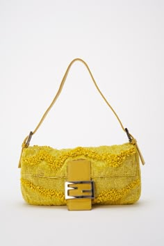 An incredibly rare bag! A Fendi 15th Anniversary Limited Edition Gialla Lemon Yellow Sparkly Iridescent Beaded baguette bag. Fendi recently re:launched this style and colour-way as they celebrated 25 years of the Baguette bag with 25 re-editions of the famous “under-the-arm” bag’s most iconic archived styles. This re:issue version retails for £4500, causing the original style to be in demand more than ever. This bag comes with the original dust bag, paper Fendi bag and a bag of spare beads for a Vintage Fendi Baguette, Designer Bags Louis Vuitton, Fendi Bag, Vintage Fendi, Burberry Sunglasses, Fendi Baguette, Baguette Bag, Pretty Bags, Mellow Yellow