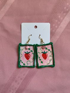 Splendid Strawberry earrings are the perfect earrings for picnics, ice cream dates, and trips to the beach! They remind you of soft summer afternoons! My earrings are meant to be art pieces that you can wear. Time and love is put into hand painting each design and handcrafting each frame, making each set of earrings unique for you. I paint the design on sturdy cardstock. Next I sculpt a hot glue frame around the piece, which I paint and seal with Mod Podge. The earrings are finished with a small gemstone or bead and nickel/lead free earring hooks. The earrings are durable, yet lightweight. They can be worn by anyone on any occasion!  Art and beauty is for everyone. Thank you for visiting my garden! <3 Dangle Earrings As Summer Gifts, Vintage Summer Jewelry Gift, Pink Earrings For Summer Gift, Vintage Jewelry As Summer Gift, Vintage Jewelry For Summer Gifts, Pink Summer Earrings Gift, Green Earrings For Summer Gift, Cute Summer Jewelry For Gifts, Sweet White Summer Jewelry