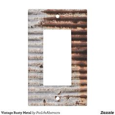 an old metal light switch plate cover with rusted paint on the bottom and sides