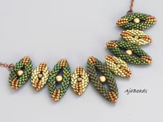 a beaded necklace with green and yellow beads