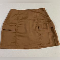 Kendall & Kylie Satin Cargo Mini Skirt. Size Small L. Brand New With Tags. Super Soft And Lightweight. Trendy And Fun! Smoke Free/Pet Free Home. Brown Lined Mini Skort, Brown Mini Skort, Fitted Mini Cargo Skirt With Lining, Fitted Mini Skort With Pockets, Fitted Lined Mini Cargo Skirt, Fitted Brown Skirt With Pockets, Brown Pencil Skirt With Pockets, High Waist Brown Skort With Pockets, Brown Mini Skirt With Pockets