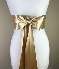 "Gold Sash, Gold Satin Sash  Light Gold Wedding Dress Sash Belt  Satin Sash, Gold Bridal Sash  Obi Sash Belt in Gold  Satin Swank  Make this Satin Swank® reversible waist sash the perfect finishing touch for your wedding, bridesmaid, or special occasion dress, or just the right piece to add instant polish to your dress or top.  This extra long version is 3.5 inches wide, 120 inches long, and will wrap around most waist sizes two times with a generous length remaining to tie in a bow or a simple Satin Sashes For Bridesmaids, Wedding Sash With Tie Back, Fitted Bow Sash For Bridesmaid, Wedding Satin Tie Back Sash, Elegant Satin Sash With Tie Back, Fitted Bridesmaid Sash With Bow, Gold Belts With Sashes For Formal Wear, Wedding Bridal Belt With Sashes In Satin, Fitted Satin Sashes With Satin Bow