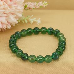 Step into a world of rejuvenation and abundance with our Emerald Jade Bracelet, a symbol of growth, renewal, and prosperity. Crafted from exquisite emerald jade beads, this bracelet serves as a reminder to embrace the endless possibilities of new beginnings and to manifest abundance in all areas of your life. * High-Quality Beaded Bracelet* Unisex Bracelet* 8mm beads* Made to Fit Your Wrist or Anklet* Made with Pure Positive Energy* Great Gift for Everyone Green Onyx Bracelets - Gift, Green Jade Crystal Bracelet For Meditation, Green Spiritual Crystal Bracelet For Healing, Green Spiritual Bracelets For May Birthstone, Spiritual Green Bracelets For May Birthstone, Spiritual Green Crystal Bracelet For Healing, Green Spiritual Bracelet For May Birthstone, Green Jade Crystal Bracelet Spiritual Style, Green Jade Crystal Bracelet For Spiritual Healing