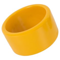 This is a great-looking yellow creamed corn Bakelite bracelet bangle. It boasts an extra-wide sliced shape and an intense, bright, plain yellow color. Measurements: Inside across is 2.63 in diameter (6.7 cm) - outside across is 3.19 in diameter (8.1 cm) - width is 1.69 in wide (4.3 cm). The inner circumference of the bracelet is 8.28 in (21.04 cm). Please double-check the measurements and ask any questions before making your purchase. This item is a final sale, and we will not accept returns for Antique Bangles, Sapphire Bangle, Plain Yellow, Modern Bangle, Classic Bangles, Lucite Bracelets, Bakelite Bracelets, Antique Bracelets, Creamed Corn