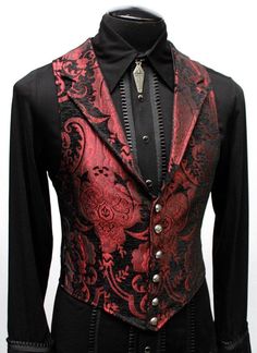 "A Victorian gentleman's vest with class. Great for formal occasions, can be worn under a suit jacket or by itself. Made in red and black tapestry fabric with black satin lining and back. This vest has a very flattering tapered fit and ties in back with satin beltings it can be made tighter in the waist. Fastens in front with six brass buttons. A notched collar adds extra style. Comes in sizes small-3X. (pictured with the empire tux shirt - sold separately) fabulous! Size small = chest 39\" wais Gothic Formal Men, Formal Red Vest For Fall, Elegant Fitted Red Vest, Fitted Red Winter Vest, Fitted Red Vest For Winter, Red Fitted Sleeveless Vest, Fitted Gothic Vest For Winter, Aristocrat Vest, Red Vest Outfit