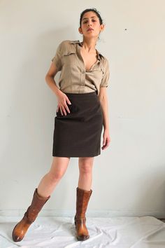 "vintage brown mini skirt Petite Sophisticate mini skirt in a brown color with zipper and button at the back for closure size 4 waist 27\" length 19.5\"" Cheap Brown Mini Skirt With Pockets, Chic Brown Skort For Workwear, Fitted Workwear Skort With Button Closure, Fitted Skort With Button Closure For Work, Retro Fitted Brown Skort, Brown Mini Skirt With Button Closure For Work, Brown Fitted Short Skirt, Brown Lined Mini Skort, Brown Fitted Mini Skirt For Fall