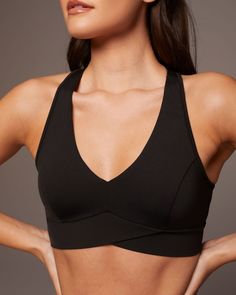 Designer’s Notes Sporty chic meets comfort with this plunging v-neck bra. Crafted in our signature buttery soft, sweat-wicking fabric so you can wear it from day to night. Features a secure 2.5" chest-band for optimal support. Features Flattering Deep V Neckline Pointed "inverted V" Front Chest-band Removable bra cups provide shape and coverage Sweat-wicking Breathable 8-way stretch Made with Love in Canada Designed for: medium intensity workouts Size & Fit Medium support Modeled in size S Model Theatrical Romantic, Designer Activewear, Sports Bra Design, Best Sports Bras, Bra Models, Popular Sports, Longline Bra, Activewear Brands, Black Activewear