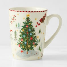 a coffee cup with a christmas tree on it