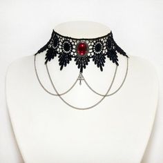 This choker combines the elegance of black venise lace with a beautifully ornate Ruby red pendant (26 x 22 mm), draped chains and a small central cross (20 x 10 mm). The lace is finished off securely with an extender chain which allows the necklace/choker to be worn at any size from 13 to 15.5 inches. With the addition of an extender chain you can be sure of getting the fit you want and can choose between wearing the choker higher or lower on the neck. This item can be made larger or smaller if Chains Cross, Dark Royalty, Gothic Choker Necklace, Vampire Jewelry, Gothic Choker, Steampunk Rings, Lace Choker Necklace, Red Pendant, Gothic Chokers