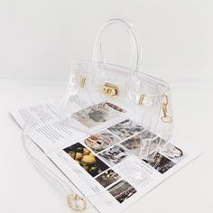 SPECIFICATIONSTypes of bags: Shoulder & HandbagsStyle: FashionSmall size: 25*12*18cmShape: Casual TotePop element: TransparentPlace Of Origin: GUANG DONG ProvincePlace Of Origin: GUANG DONG ProvincePattern Type: SolidOrigin: CN(Origin)Number of Handles/Straps: SingleMain Material: PVCLining Material: PolyesterLarge size: 30*14*24cmInterior: Cell Phone PocketHardness: SoftHandbags Type: TotesGender: WOMENExterior: Solid BagColor: Laser light, TransparentClosure Type: COVERCN: GuangdongBag trend s Trendy Bags With Clear Strap And Top Handle, Trendy Top Handle Bag With Clear Strap, Trendy Top Handle Shoulder Bag With Clear Strap, Clear Crossbody Bags For Shopping, Clear Strap Shoulder Bag Satchel For Shopping, Clear Crossbody Satchel With Clear Strap, Daily Use Top Handle Shoulder Bag With Clear Strap, Trendy White Plastic Bags, Clear Top Handle Shoulder Bag For Everyday Use