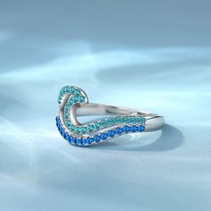 The design of this promise ring is made of two layers of wave design, the upper layer is light blue, the lower layer is dark blue, very vivid expression of the wave in your finger with gradient color. Wear this pave wave ring to the beach in the summer, will definitely have a more fashionable sense. This Promise ring is also suitable daily or official occasion, simple and cool.Material: 925 SilverPlating Color: Silver Ocean-inspired Blue Ring For Gift, Ocean-inspired Blue Ring For Gifts, Ocean-inspired Blue Rings As Gifts, Adjustable Blue Rings For Promise, Adjustable Blue Promise Rings, Blue Ocean-inspired Jewelry For Anniversary, Ocean-inspired Blue Jewelry For Anniversary, Wave Ring, Pave Ring