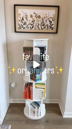 a white book shelf filled with lots of books