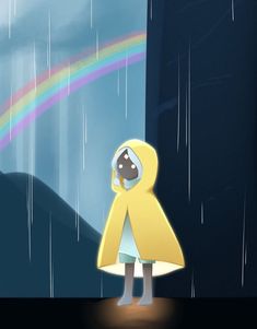 a person in a yellow raincoat standing under a rainbow