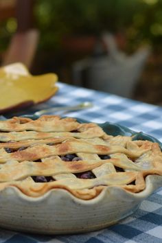 a blueberry pie sitting on top of a table