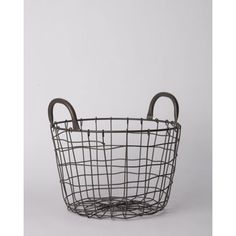 a wire basket with handles on the bottom and an oval handle in the middle, against a white background