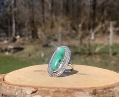 Vintage Navajo Banded Malachite Silver Ring - Long Oval Green Cabochon Ring - Everyday 925 Ring - Signed M. Benally Ring - WhistlingGypsyVTG Stone Size: 23 x 9mm Face: 1.160 x .630" Shoulder Width: .220" Base Width: .100" Size: 6.25 Stamped: "Sterling M Benally" Handcrafted from sterling silver, this vintage Navajo ring holds an oval green malachite cabochon. The stone is a silky green with lace banding in a deeper hue. Nestled in a scalloped bezel, the stone is embraced by a roped border and accented by an artfully cut frame. Split shoulders support the face and gently taper to one solid band at the base. The piece has a nice weight, not too heavy or light and feels very comfortable on the finger! If you have any questions please don't hesitate to ask and thanks for looking! More vintage Navajo Ring, Ring Everyday, Shoulder Support, Navajo Rings, Lace Bands, Green Malachite, Cabochon Ring, 925 Ring, Vintage Navajo