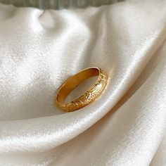 14k gold filled - handcrafted - waterproof - tarnish proof - hypoallergenic. Beautiful 14k gold filled floral band ring that is perfect for everyday wear. This gold flower band can even be worn as a wedding band. Made of 14k gold filled very thick and sturdy metal. Gold Dainty Engraved Ring Tarnish Resistant, Delicate 14k Gold Band, Dainty Gold Engraved Ring Tarnish Resistant, Dainty Gold Engraved Tarnish-resistant Ring, Dainty Engraved Gold Round Band Ring, Elegant Gold Flower Ring With Round Band, Delicate Gold Engraved Ring For Wedding, Delicate Gold Engraved Wedding Ring, 14k Gold Filled Open Rings For Wedding