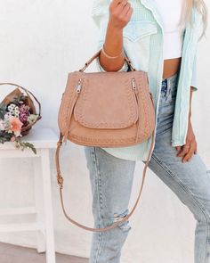 THIS ITEM IS FINAL SALE Best Seller Measurements: 12.00 "L x 5.00 "W x 9.50 "H Handle Drop: 3" Additional Shoulder Strap Drop: 20"- 23" Bag Type: Saddle Material: Faux Leather Interior Details: Two Slip Pockets. One Zip Pocket Exterior Details: Thick Stitching Details And Zipper Tassel Hardware: Gold Extras: Detachable Adjustable Strap Closure: Zipper Fabric Lining //Best Seller// The coveted Highland Bag in natural is essential for everyday wear in its designer look and practical details.Styled Thick Stitching, Tortoise Hair, Ankle Stretches, Leopard Hair, Simple Bangle, Perfect Heels, Exterior Details, Faux Leather Bag, Stitching Details