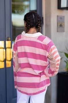 The ASTER STRIPE TEE offers a modern twist on the classic tee. Its oversized and provides a comfortable and stylish fit, while the unique design of different size stripes adds a touch of personality. Details + Fi Machine Wash cold Do Not Bleach Lay Flat To Dry Fits true to size Model is 5’7” and wearing size small Trendy Relaxed Fit T-shirt With Contrast Stripes, Fall Crew Neck Top With Signature Stripes, Sporty Tops With Striped Hem And Relaxed Fit, Oversized Striped Tops For Streetwear, Sporty Relaxed Fit Top With Striped Hem, Oversized Sporty Tops With Contrast Stripes, Casual Pink Top With Striped Collar, Pink Cotton Top With Contrast Stripes, Casual Oversized Tops With Contrast Stripes