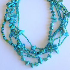 Artisan Czech Glass Bead 6 Strand 18" Long Fashion Statement Necklace Turquoise Green A Total Length Of 18" Long, With Glass Beads & Semi Precious Stone Chips. Easy To Open/Close Magnetic Clasp. One Of A Kind Necklace Handcrafted/No Two Are Exactly Alike Czech Glass Beads Are Know World Wide For Their Quality, Vibrant Colors Handmade In Guatemala Using Artisan Crafted Czech Glass Beads. Principles Of Fair Trade Are Upheld. Chip Bead Necklace, Purple Pendant Necklace, Meteorite Necklace, Art Deco Pendant Necklace, Enchanted Jewelry, Swarovski Crystal Hearts, Long Statement Necklace, Stone Chips, Art Deco Pendant