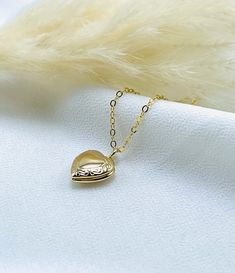 This heart shaped photo locket is very cute and delicate perfect for everyday wear. Dainty heart locket, Minimalist heart locket, Vintage photo locket necklace, Love locket necklace, medallion locket, Small heart locket, Gold heart locket, gift for her  -------------------------------------- DETAILS  * Locket material: 18k gold plated  * Size: 10.5mm x 12mm * Chain Material: 14k gold filled  * Chain length: Choose from drop down menu  * Chain style: Cable, Satellite, Paperclip  * Choose Your favorite style from drop down menu  SHIPPING  * Free domestic shipping on all orders  PACKAGING  * All pieces comes beautifully and carefully packaged in a jewelry box  * Feel free to ask any questions regarding this item! Thank you 🌸 Everyday Heart Locket Necklace For Valentine's, Dainty Heart Locket Necklace With Charm, Dainty Heart Pendant Locket Necklace With Charm, Dainty Heart Locket Necklace With Delicate Chain, Heart Shaped Dainty Locket Necklace With Delicate Chain, Dainty Open Heart Locket Necklace, Dainty Open Heart Locket Necklace With Heart Charm, Dainty Everyday Locket Necklace, Dainty Locket Necklace For Everyday