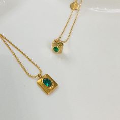 This minimalist necklace is designed with a charming emerald pendant measuring 8mm x 9mm (0.8cm x 0.9cm), this necklace offers understated beauty that complements any outfit. The adjustable chain allows for versatile styling, ranging from 42cm to 45cm in length, ensuring a perfect fit for every neckline. *18ct gold-plated tarnish-free chain necklace *Green stone beaded chain *Waterproof emerald zircon square pendant *Elegant and durable design *Tarnish-free and water-resistant *Ideal for women o Gold Minimalist Emerald Necklace With Clavicle Chain, Minimalist Gold Emerald Necklace As Gift, Dainty Green Tarnish-resistant Necklace, Green Minimalist Tarnish-resistant Necklace, Dainty Gold Plated Emerald Necklace As A Gift, Minimalist Gold Plated May Birthstone Necklaces, Emerald Necklace With Delicate Chain As Gift, Emerald Necklace With Delicate Chain For Gift, Gold Emerald Pendant Necklace For Everyday